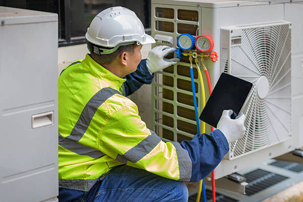 Professional Hvac technician working in Hamlet, IN